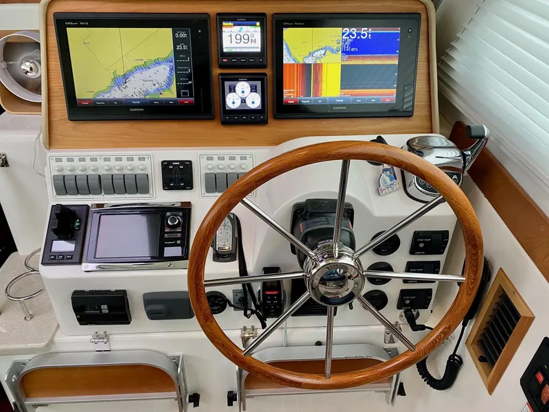 Slide: The Image of Helm of 2017 Back Cove 37 yacht featuring advanced navigation systems. - 28