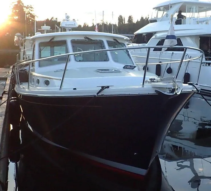 Slide: The Image of 2017 Back Cove 37 yacht docked at sunset. - 3