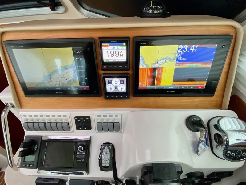 Slide: The Image of Back Cove 37 boat navigation system, 2017 model, featuring modern displays. - 30
