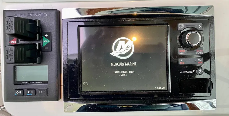 Slide: The Image of Control panel of a 2017 Back Cove 37 boat with Mercury Marine display. - 33