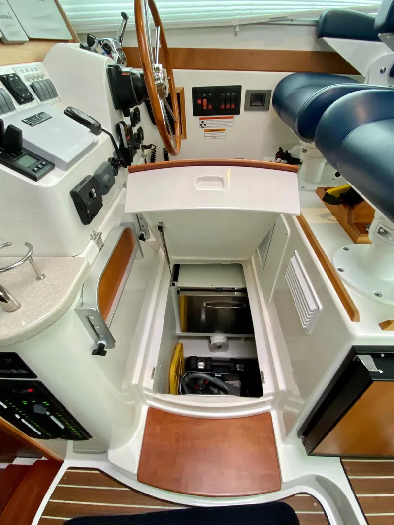 Slide: The Image of Interior of a 2017 Back Cove 37 yacht with helm console. - 38
