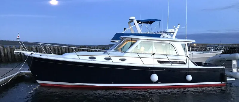 Slide: The Image of 2017 Back Cove 37 yacht docked at sunset. - 4