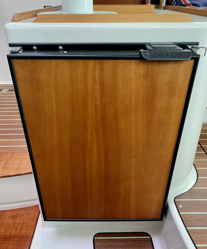 Slide: The Image of Wood-paneled fridge on 2017 Back Cove 37 yacht. - 40