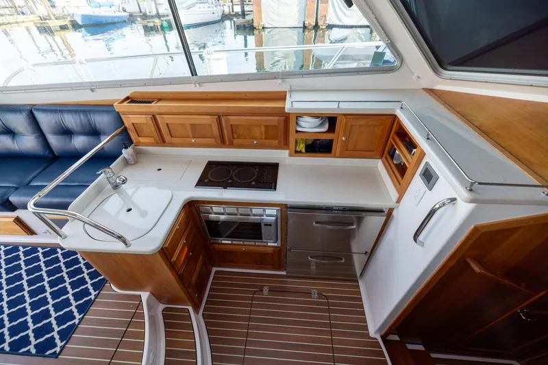 Slide: The Image of Interior view of a 2017 Back Cove 37 yacht kitchen. - 43
