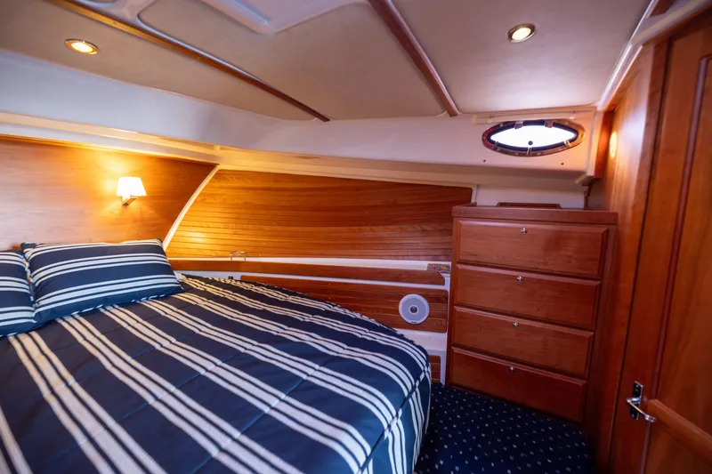 Slide: The Image of Interior of a 2017 Back Cove 37 yacht featuring a cozy bedroom. - 47