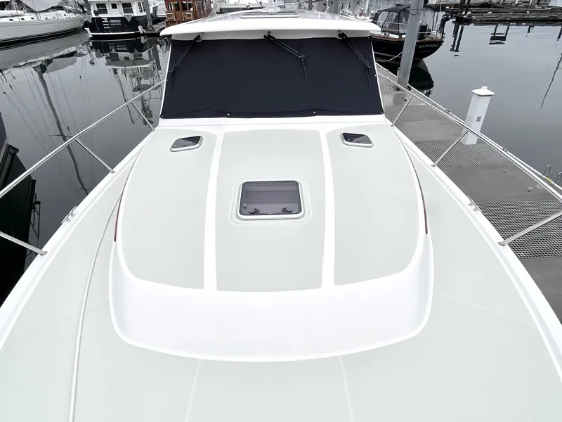 Slide: The Image of 2017 Back Cove 37 yacht docked in a serene harbor. - 8