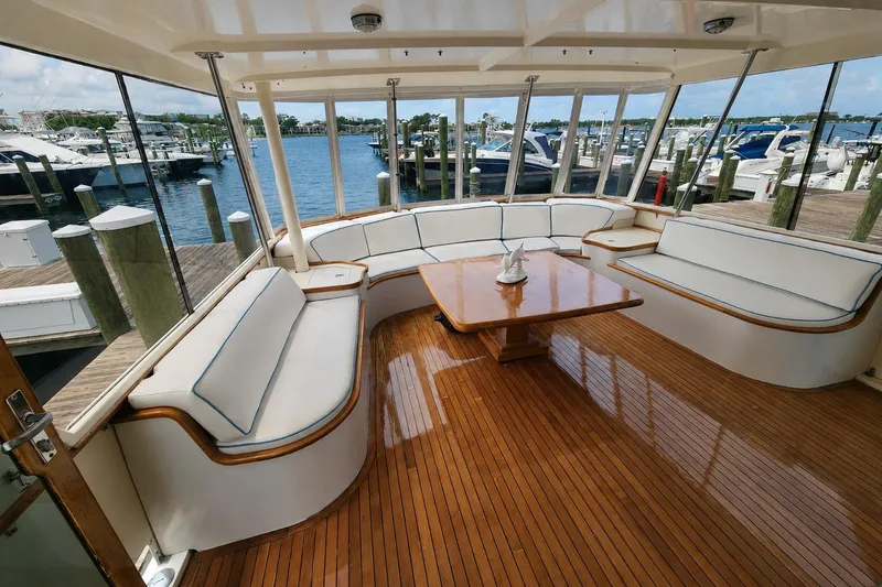 Slide: The Image of Elegant interior of 1983 Hatteras 48 Motor Yacht with polished wood flooring and spacious seating. - 2