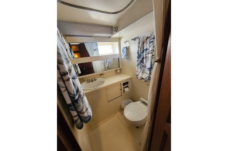 Slide: The Image of Bathroom interior of 1983 Hatteras 48 Motor Yacht with sink and toilet. - 34