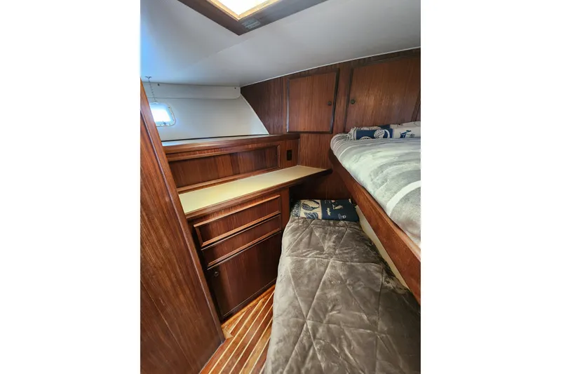Slide: The Image of Cozy cabin interior of 1983 Hatteras 48 Motor Yacht with wooden furnishings. - 36
