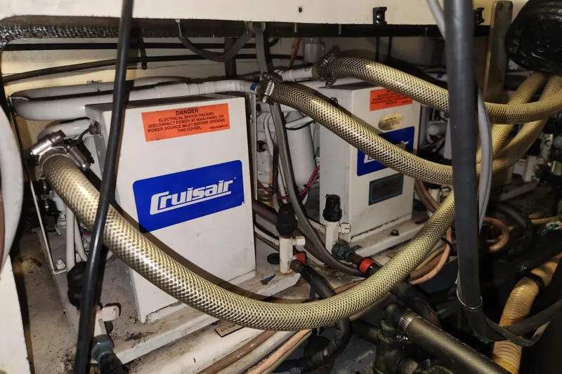 Slide: The Image of Engine room of 1983 Hatteras 48 Motor Yacht with Cruisair units and hoses. - 41