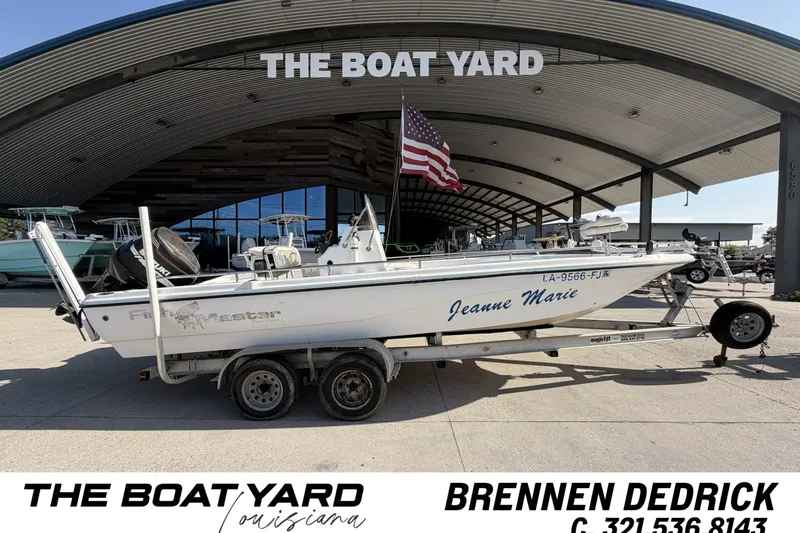 The Image of 2004 Fishmaster 24 boat "Jeanne Marie" at The Boat Yard, Louisiana, with American flag. - 0