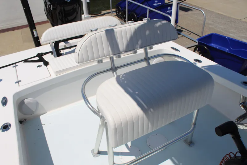 Slide: The Image of 2023 Intruder 23 boat with white seating and stainless steel frame. - 17