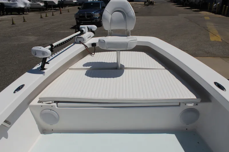 Slide: The Image of 2023 Intruder 23 boat with seating and controls. - 25