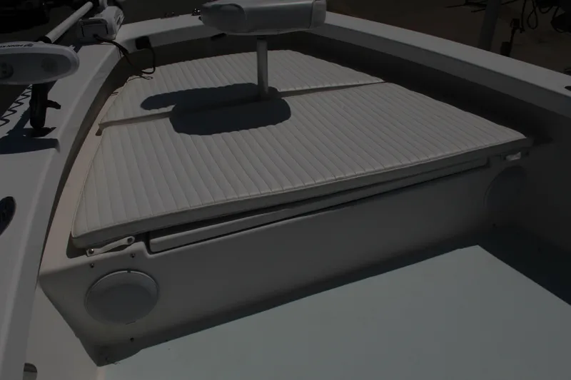 Slide: The Image of 2023 Intruder 23 boat with cushioned seating area. - 26