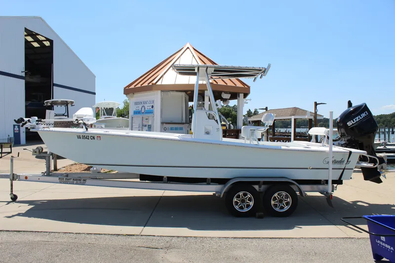 Slide: The Image of 2023 Intruder 23 boat on trailer at marina. - 3