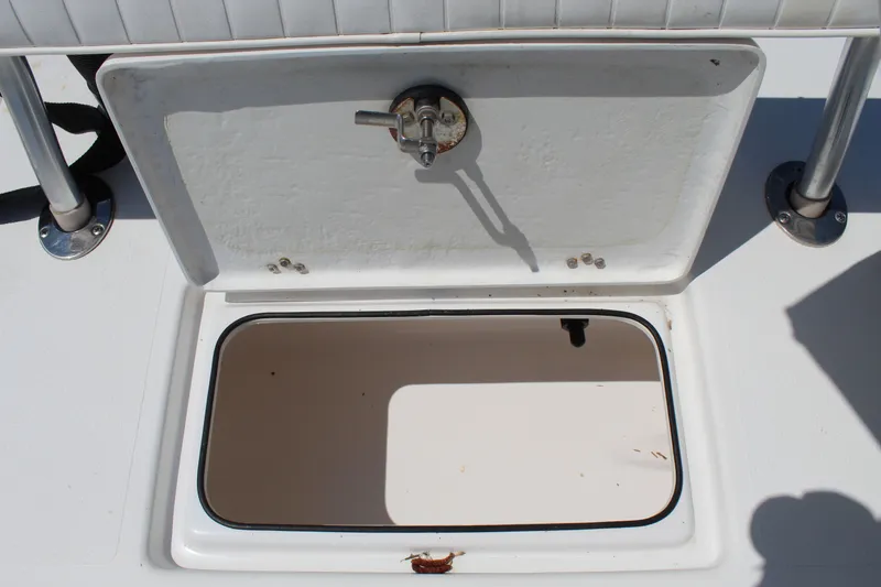 Slide: The Image of Open storage compartment on a 2023 Intruder 23 boat. - 31