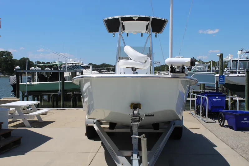 Slide: The Image of 2023 Intruder 23 boat on trailer at dock. - 5