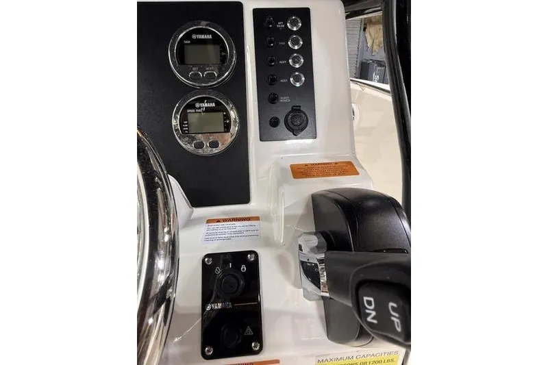 Slide: The Image of 2026 Robalo R200 Center Console dashboard with Yamaha controls and gauges. - 15