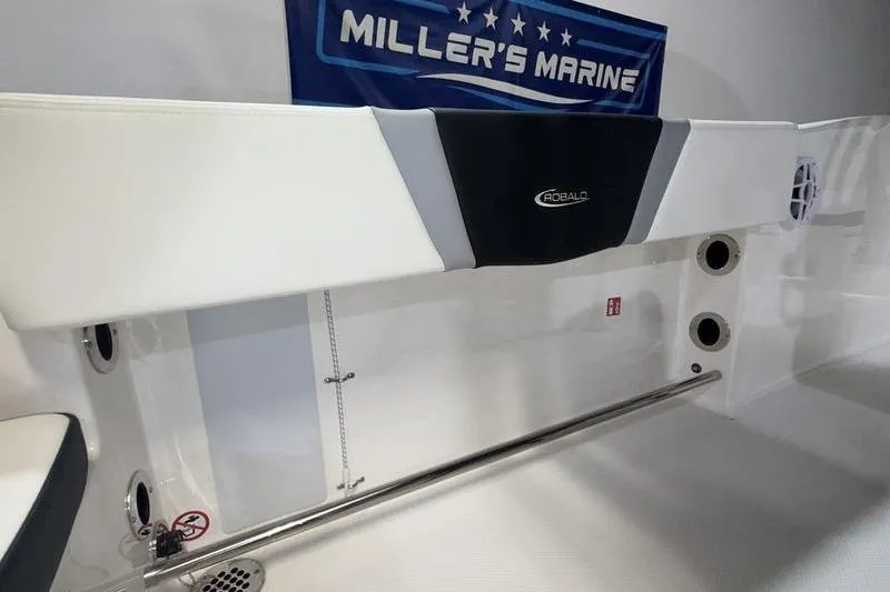 Slide: The Image of 2026 Robalo R200 Center Console interior at Miller's Marine showroom. - 18