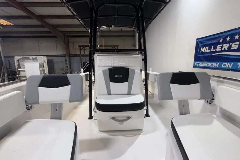 Slide: The Image of 2026 Robalo R200 Center Console boat interior with seating and console view. - 21