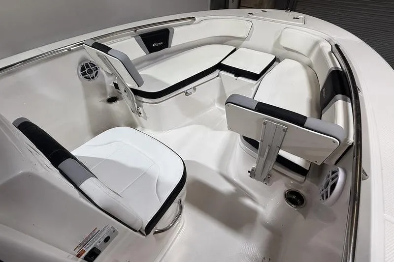 Slide: The Image of 2026 Robalo R200 Center Console boat interior with white seating and modern design. - 22