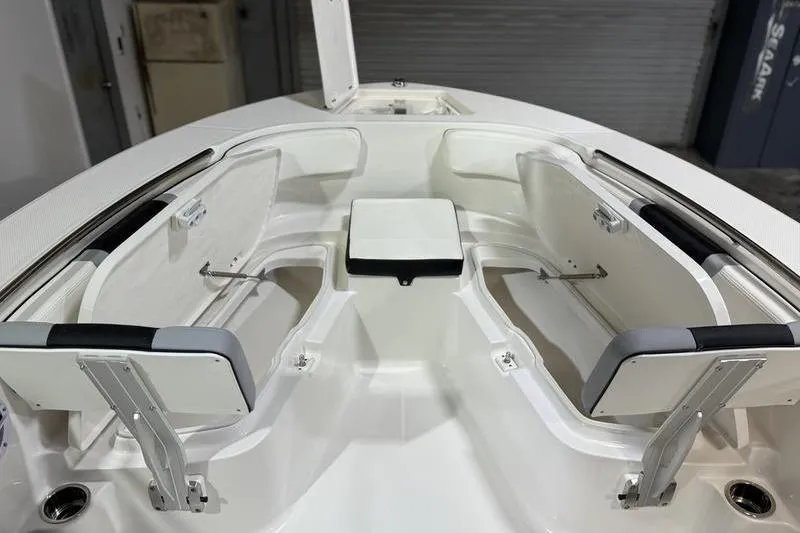 Slide: The Image of 2026 Robalo R200 Center Console boat interior with open storage compartments. - 24
