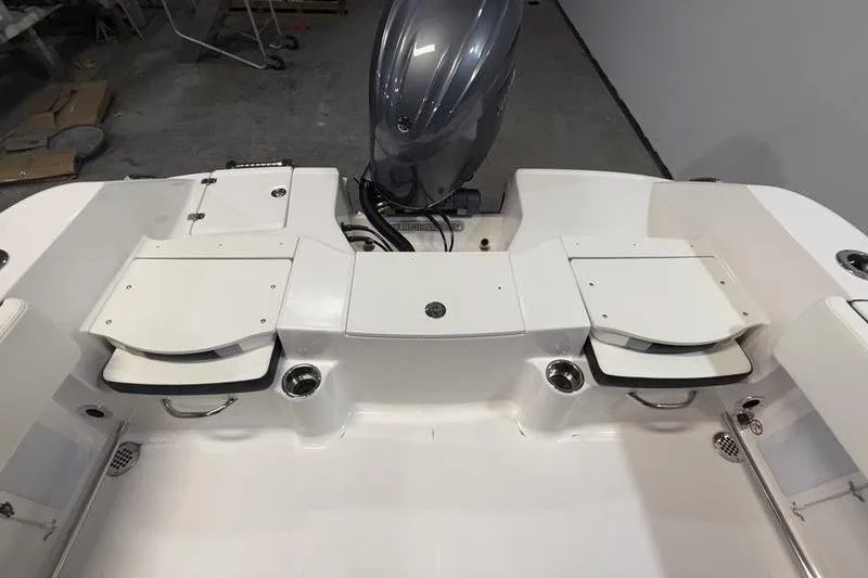 Slide: The Image of 2026 Robalo R200 Center Console boat interior with engine and seating. - 7