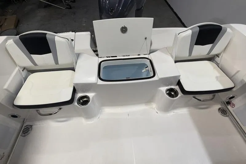Slide: The Image of 2026 Robalo R200 Center Console boat seating and storage area. - 8