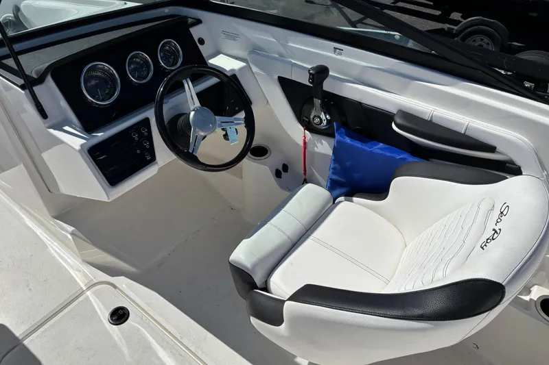 Slide: The Image of 2022 Sea Ray SPX 190 Outboard cockpit with steering wheel and comfortable seating. - 5