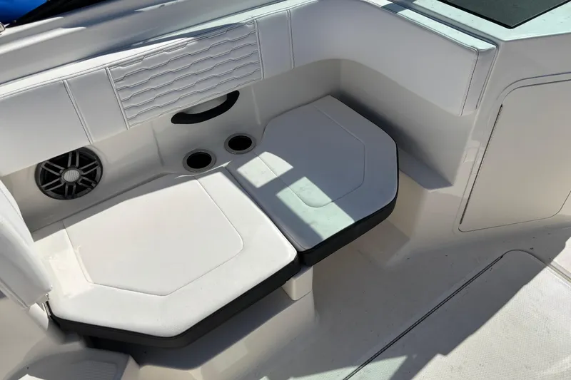 Slide: The Image of Interior seating of 2022 Sea Ray SPX 190 Outboard boat with cup holders and speaker. - 6