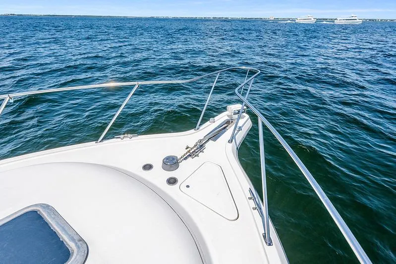 Slide: The Image of Bow view of 2000 Tiara 3500 EXPRESS yacht on open water. - 10
