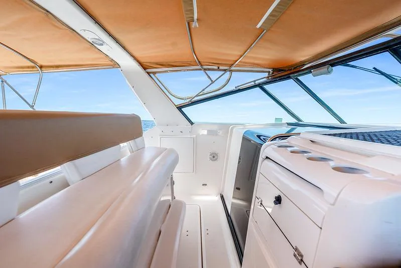 Slide: The Image of Interior view of 2000 Tiara 3500 EXPRESS yacht with tan seating and cabinetry. - 20