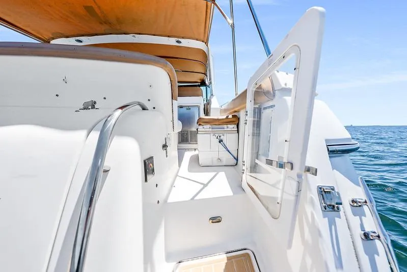 Slide: The Image of Tiara 3500 EXPRESS 2000 yacht deck with ocean view and seating area. - 23