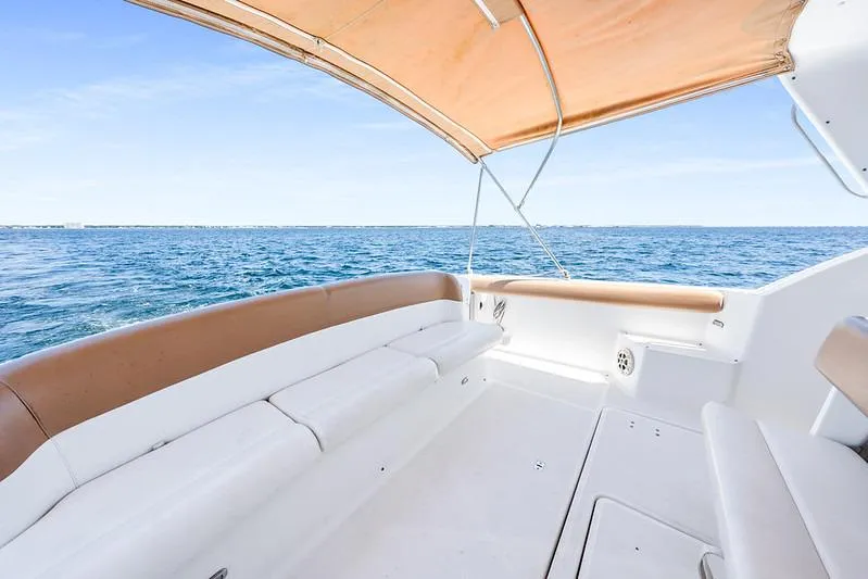 Slide: The Image of Tiara 3500 EXPRESS 2000 boat interior with ocean view and canopy. - 29