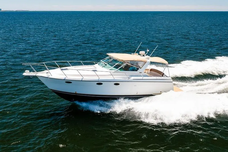 Slide: The Image of 2000 Tiara 3500 EXPRESS yacht cruising on open water. - 3