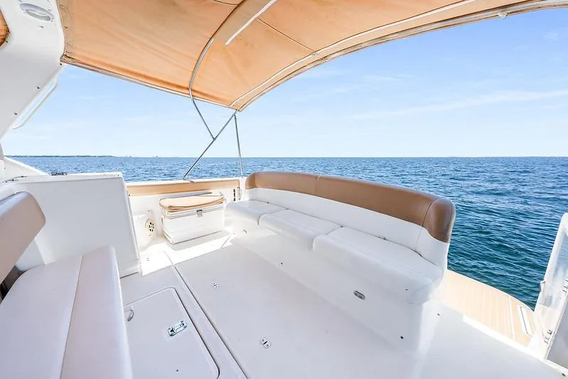 Slide: The Image of Spacious deck of 2000 Tiara 3500 EXPRESS yacht with ocean view and canopy. - 30