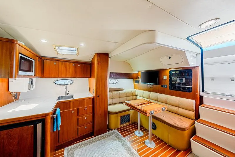 Slide: The Image of Luxurious interior of 2000 Tiara 3500 EXPRESS yacht with kitchen and seating area. - 33