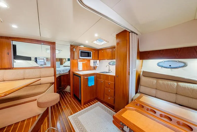 Slide: The Image of Luxurious interior of a 2000 Tiara 3500 EXPRESS yacht with wood finishes and modern amenities. - 34