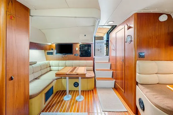 Slide: The Image of Luxurious interior of 2000 Tiara 3500 EXPRESS yacht with wood finishes and cozy seating. - 41