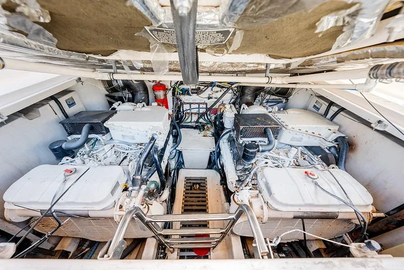 Slide: The Image of Engine room of a 2000 Tiara 3500 EXPRESS boat, showcasing dual engines and equipment. - 46