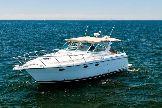Slide: The Image of 2000 Tiara Yachts 3500 Express cruising on open water. - 6
