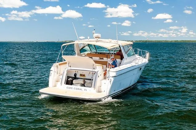 Slide: The Image of Tiara 3500 EXPRESS 2000 yacht cruising on open water under a clear sky. - 8