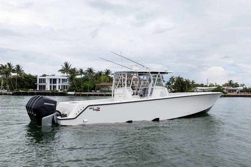 The Image of 2018 SeaVee 390Z boat with Mercury engines on a calm waterway. - 0