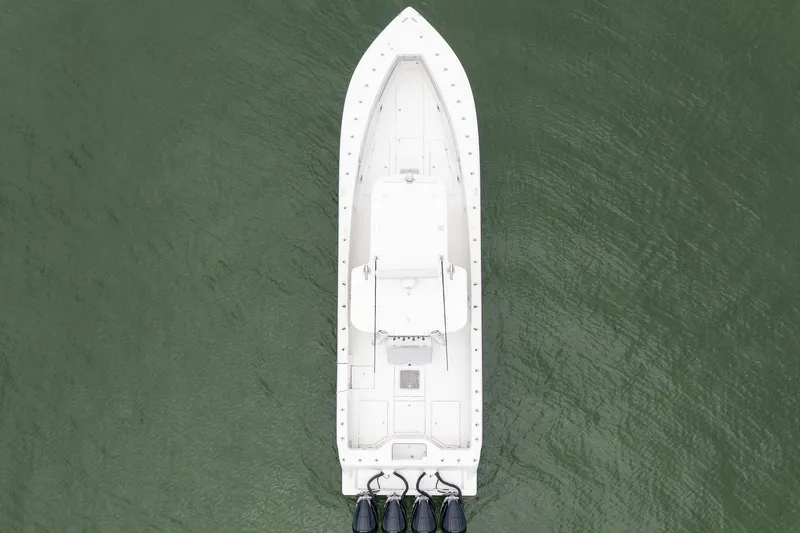 Slide: The Image of Overhead view of 2018 SeaVee 390Z boat on water with triple engines. - 14