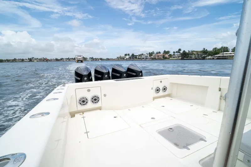 Slide: The Image of 2018 SeaVee 390Z boat with four Mercury engines on open water. - 16