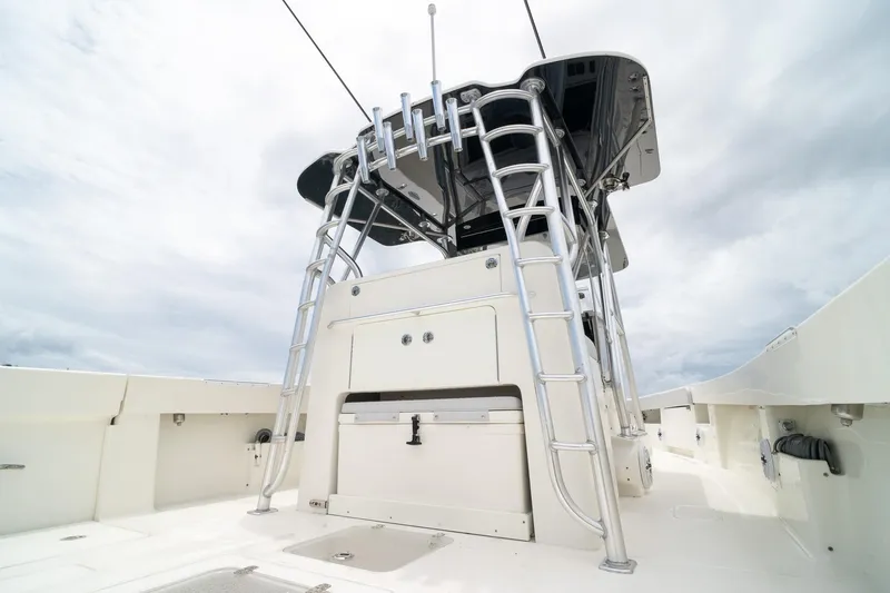 Slide: The Image of 2018 SeaVee 390Z boat with tower ladder under cloudy sky. - 26