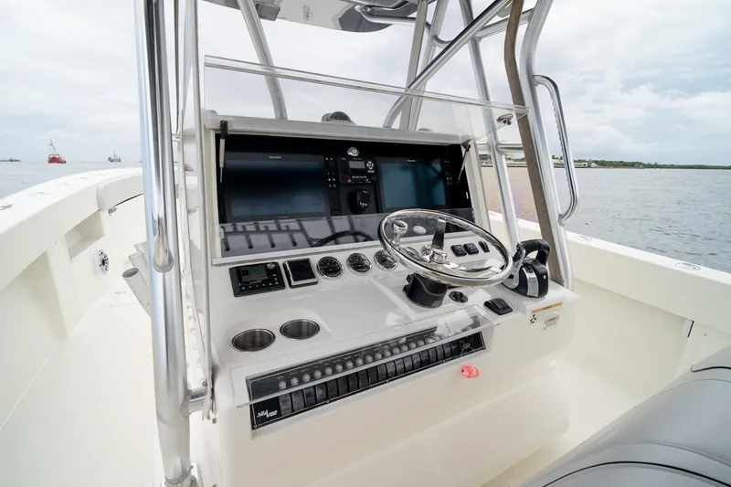 Slide: The Image of 2018 SeaVee 390Z boat helm with modern controls and ocean view. - 28