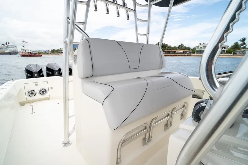 Slide: The Image of 2018 SeaVee 390Z boat interior with cushioned seating and ocean view. - 32