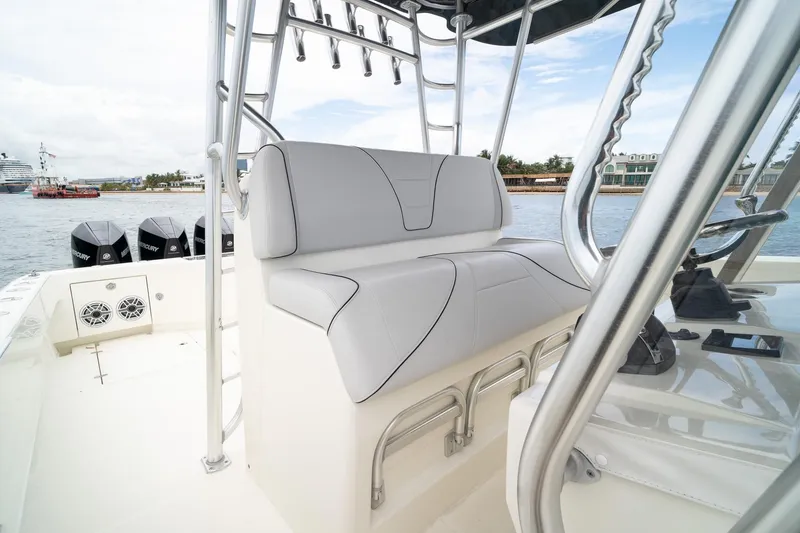 Slide: The Image of 2018 SeaVee 390Z boat interior with sleek seating and multiple outboard engines. - 33