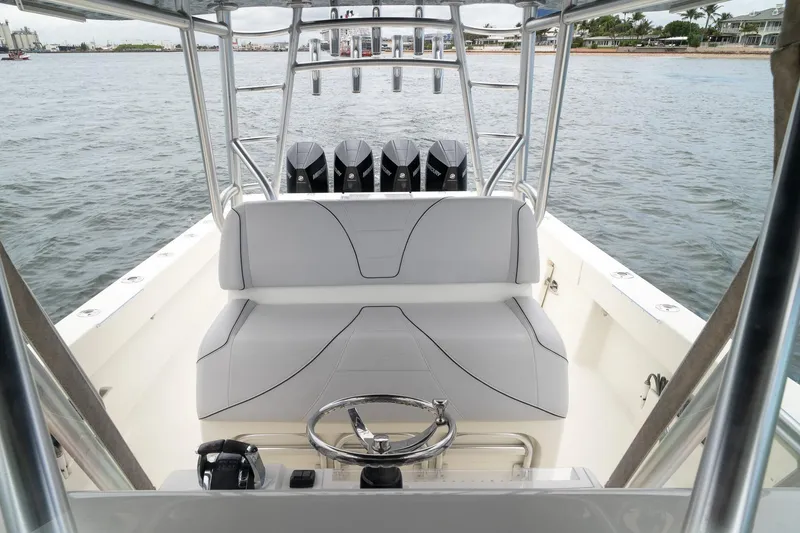Slide: The Image of 2018 SeaVee 390Z boat interior with helm, seating, and multiple outboard engines. - 34